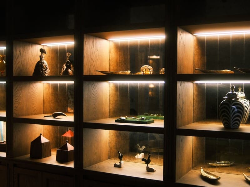 Wooden display shelves holding decorative objects