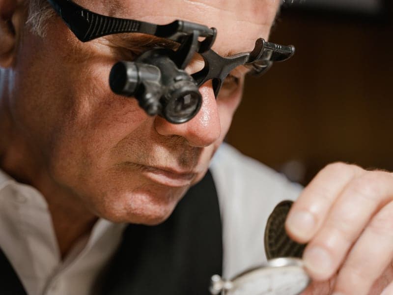 Close-up of a loupe being used to inspect a small object